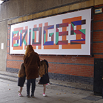 Passers by admire BUILD BRIDGES